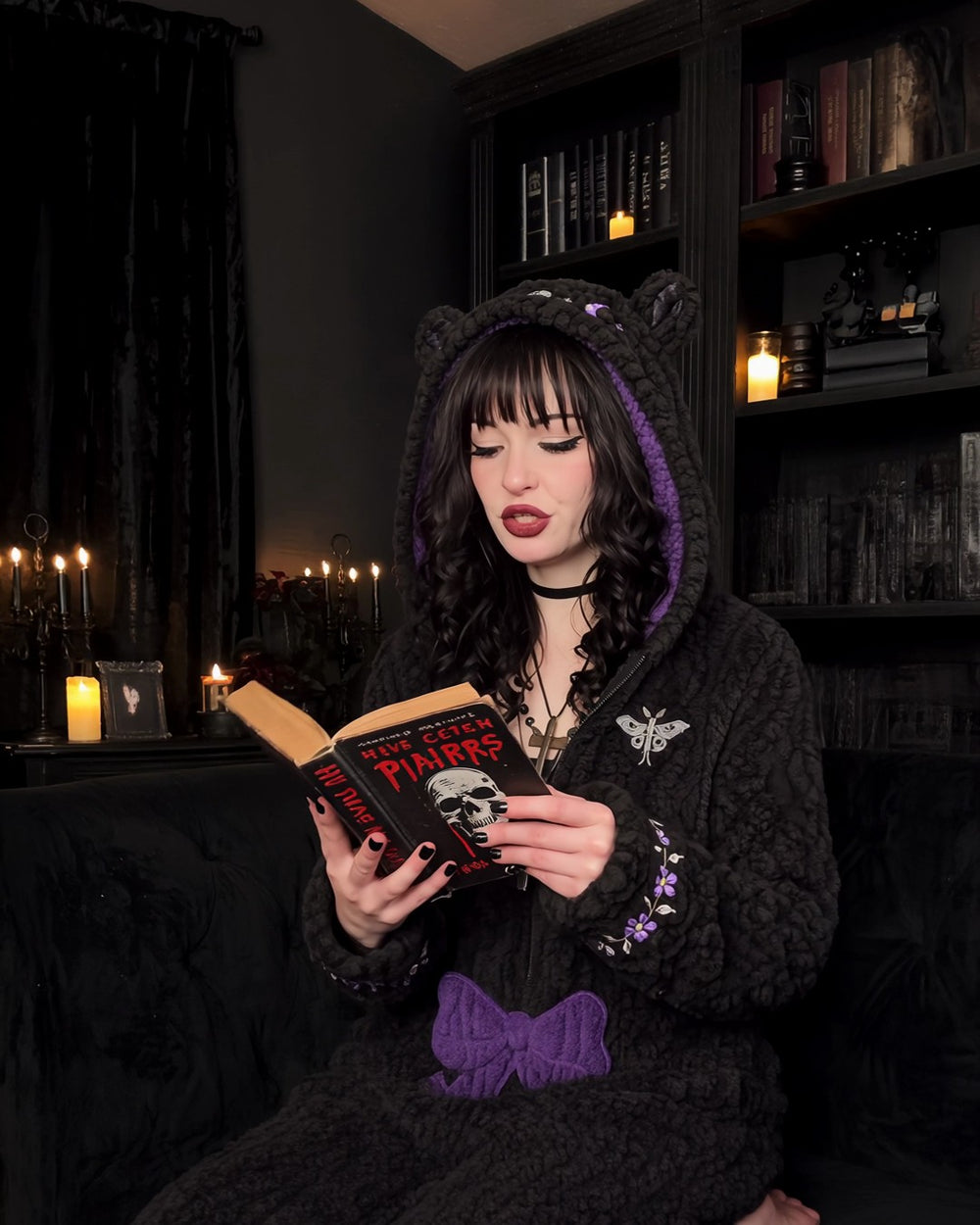 Reading on the couch in the Moonmoth Romper